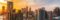 Stunning view of Melbourne's skyline at sunset, capturing modern skyscrapers and warm sky.